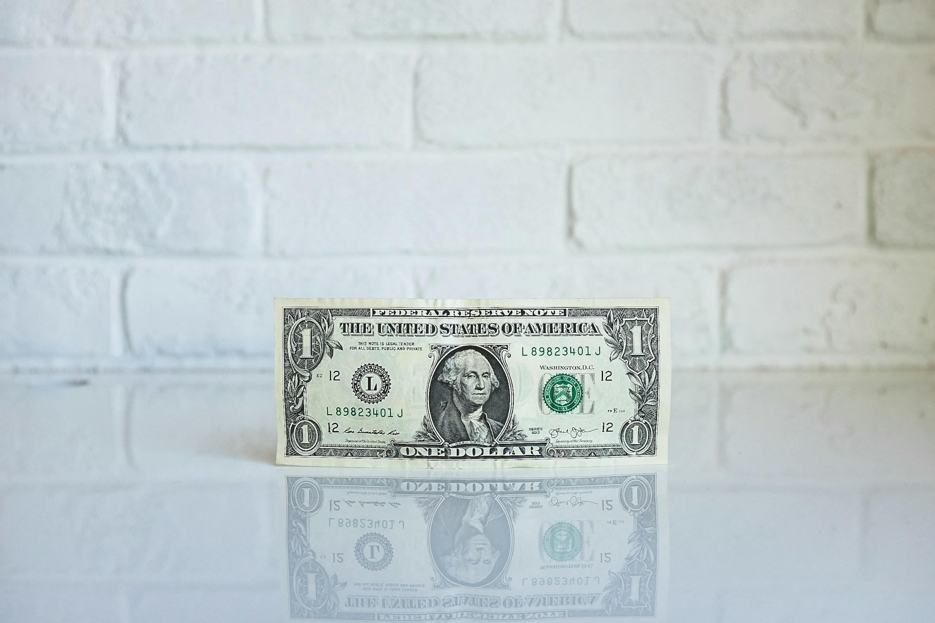 1-us-dollar-banknote-on-white-surface