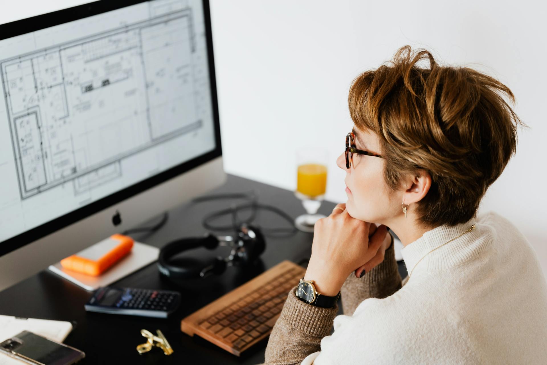 serious-woman-reading-information-on-computer