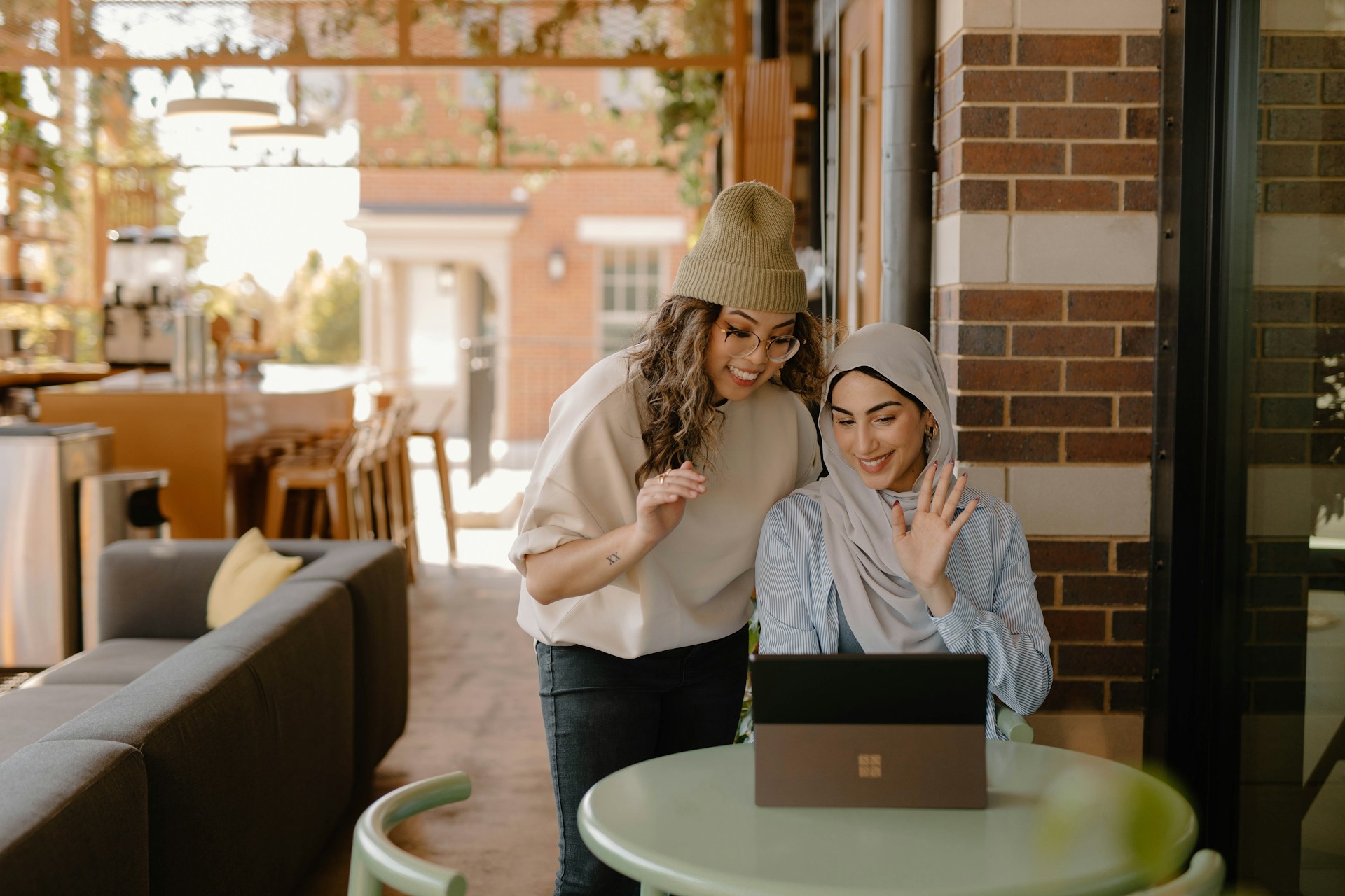 a-woman-sitting-at-a-table-using-a-laptop