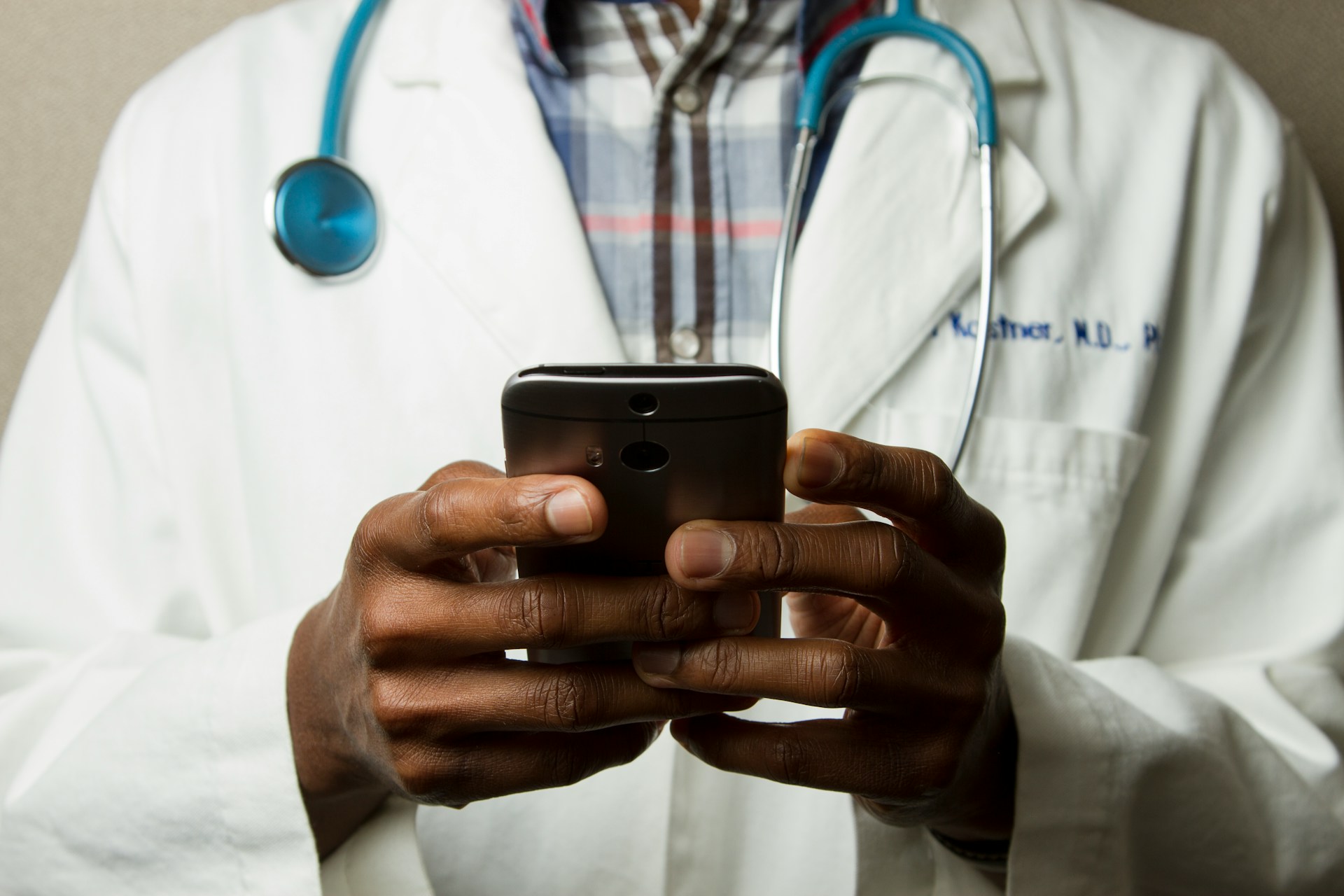 person-wearing-lavatory-gown-with-green-stethoscope-on-neck