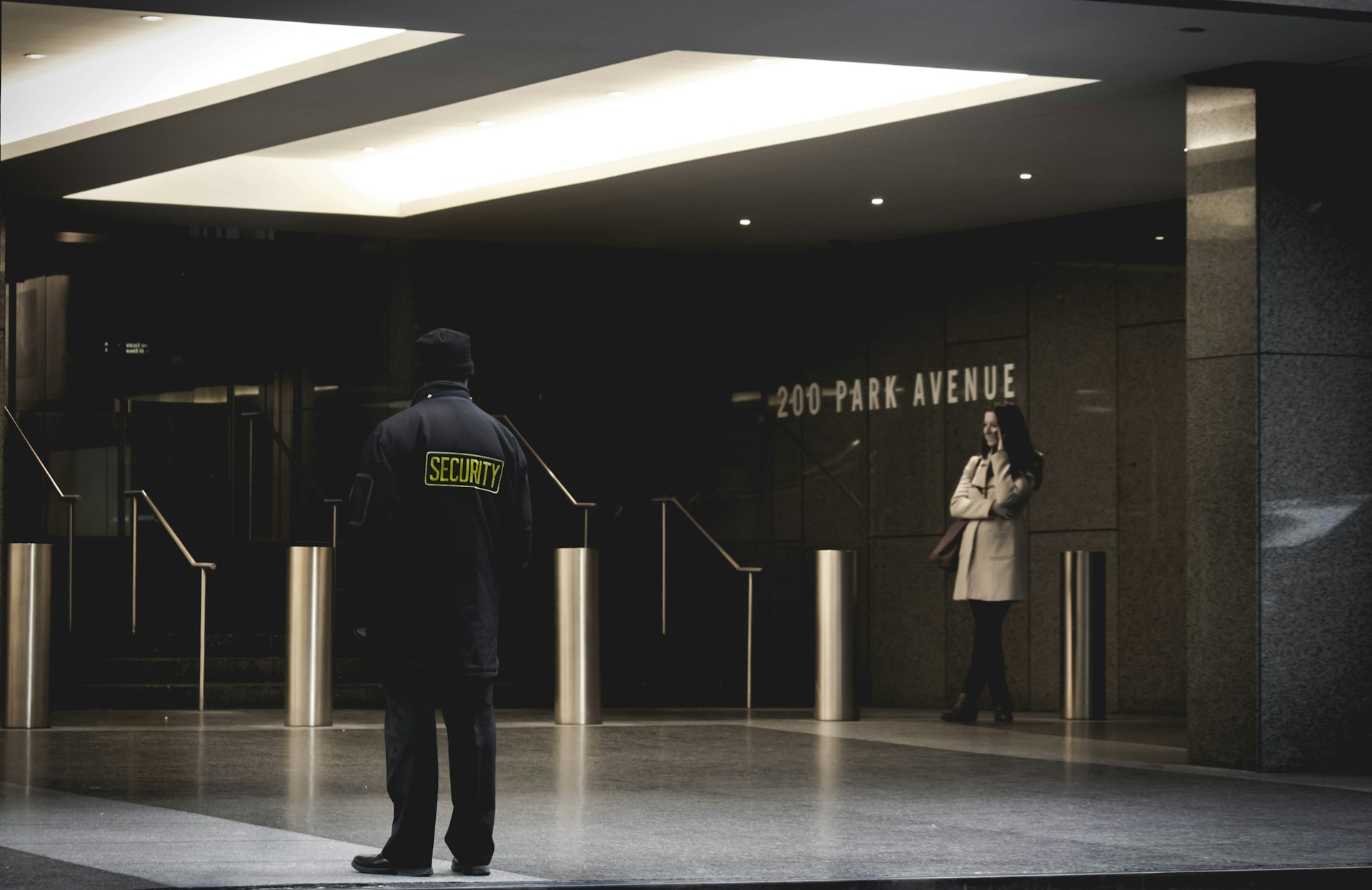 security-guard-standing-on-the-gray-floor