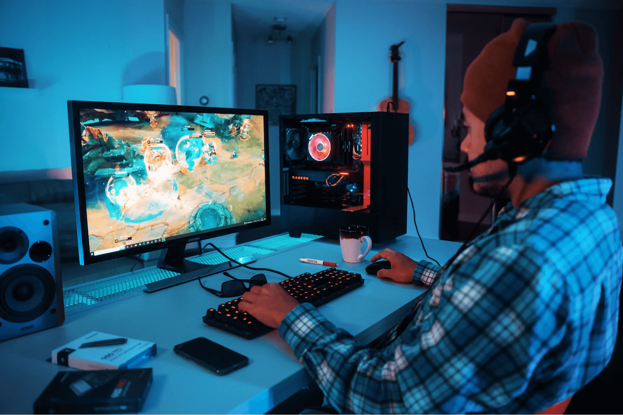A man with a headset playing a video game.