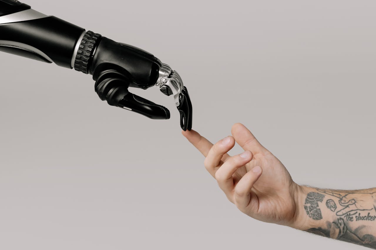bionic-hand-and-human-hand-finger-pointing