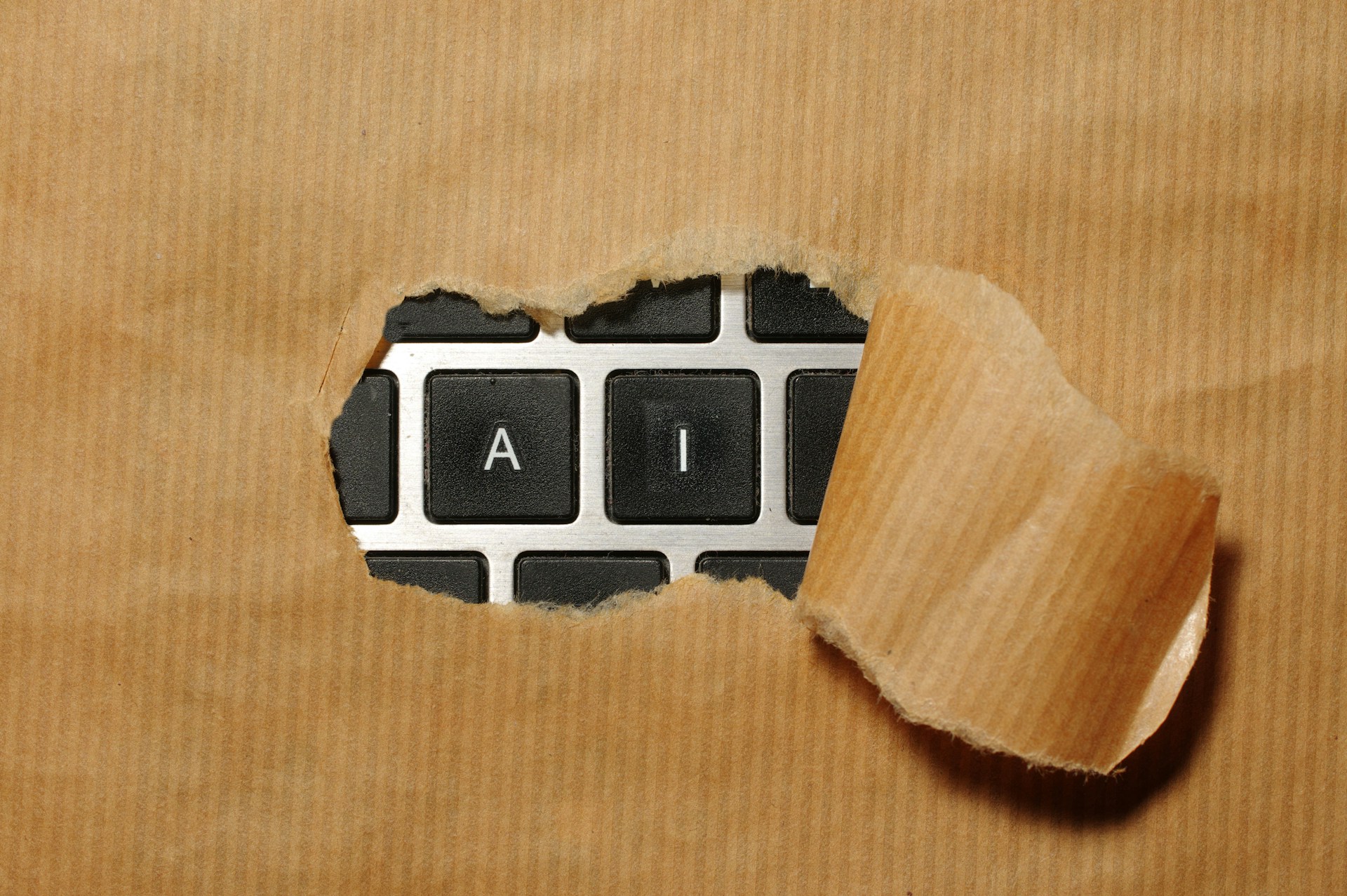 a-piece-of-cardboard-with-a-keyboard-appearing-through-it