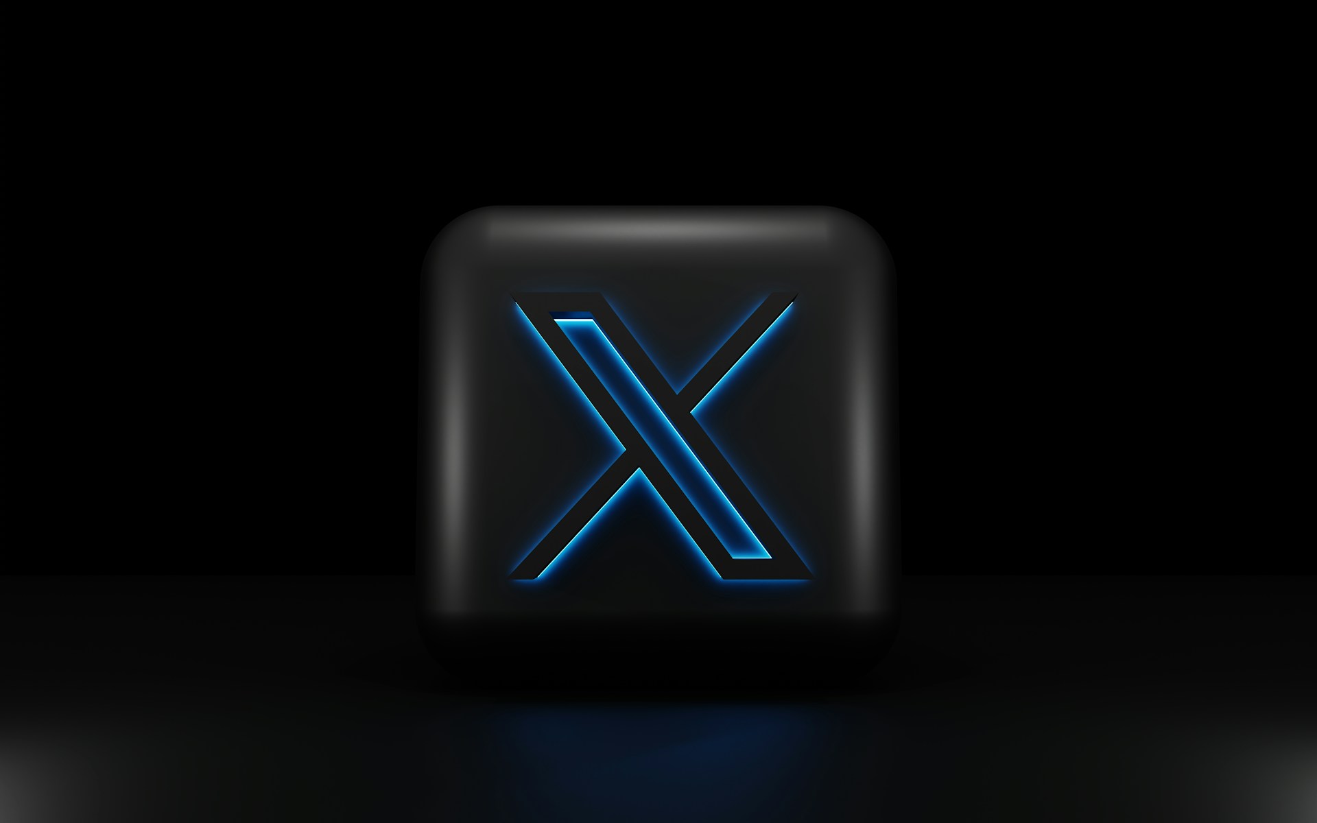 a-blue-illuminated-letter-x-on-a-black-background