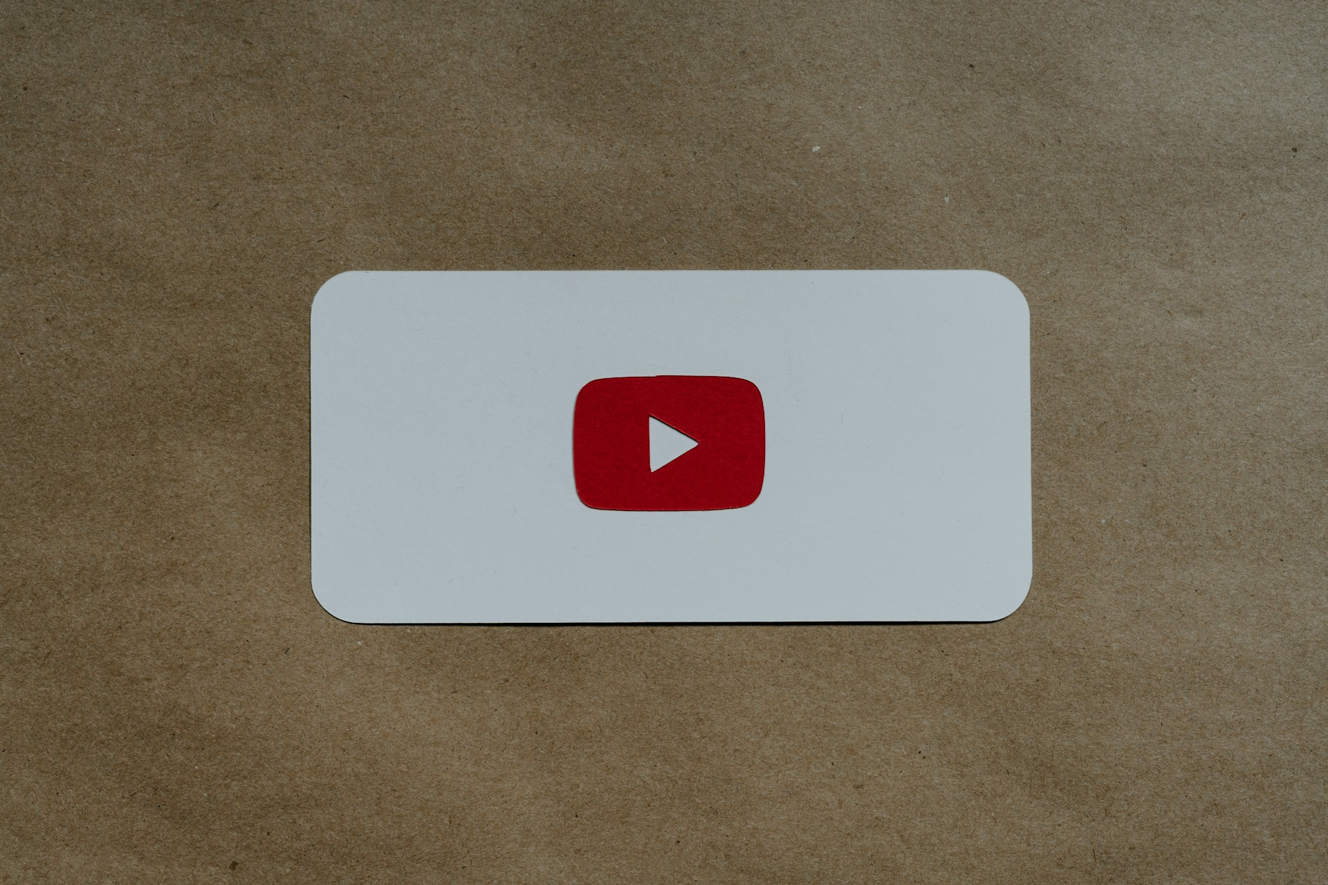 a-white-card-with-a-red-youtube-logo-on-it