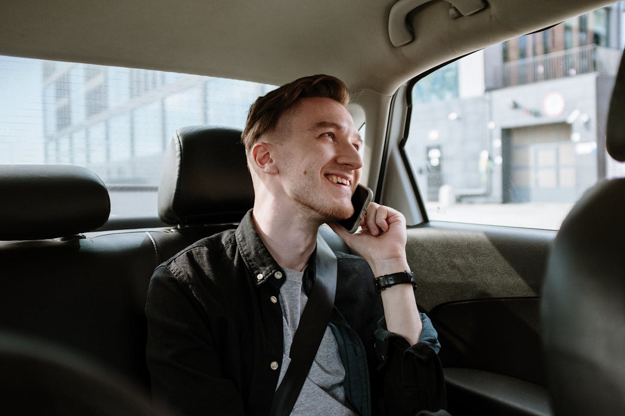 man-in-black-jacket-sitting-inside-car