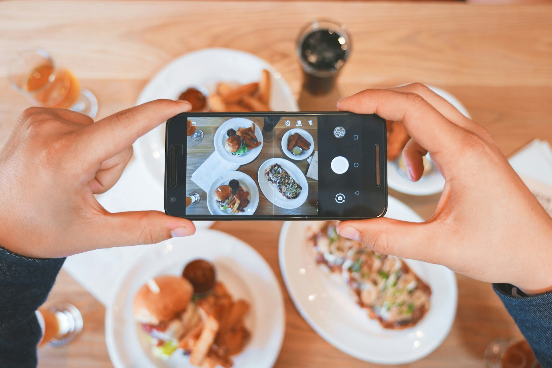 person-taking-picture-of-the-foods